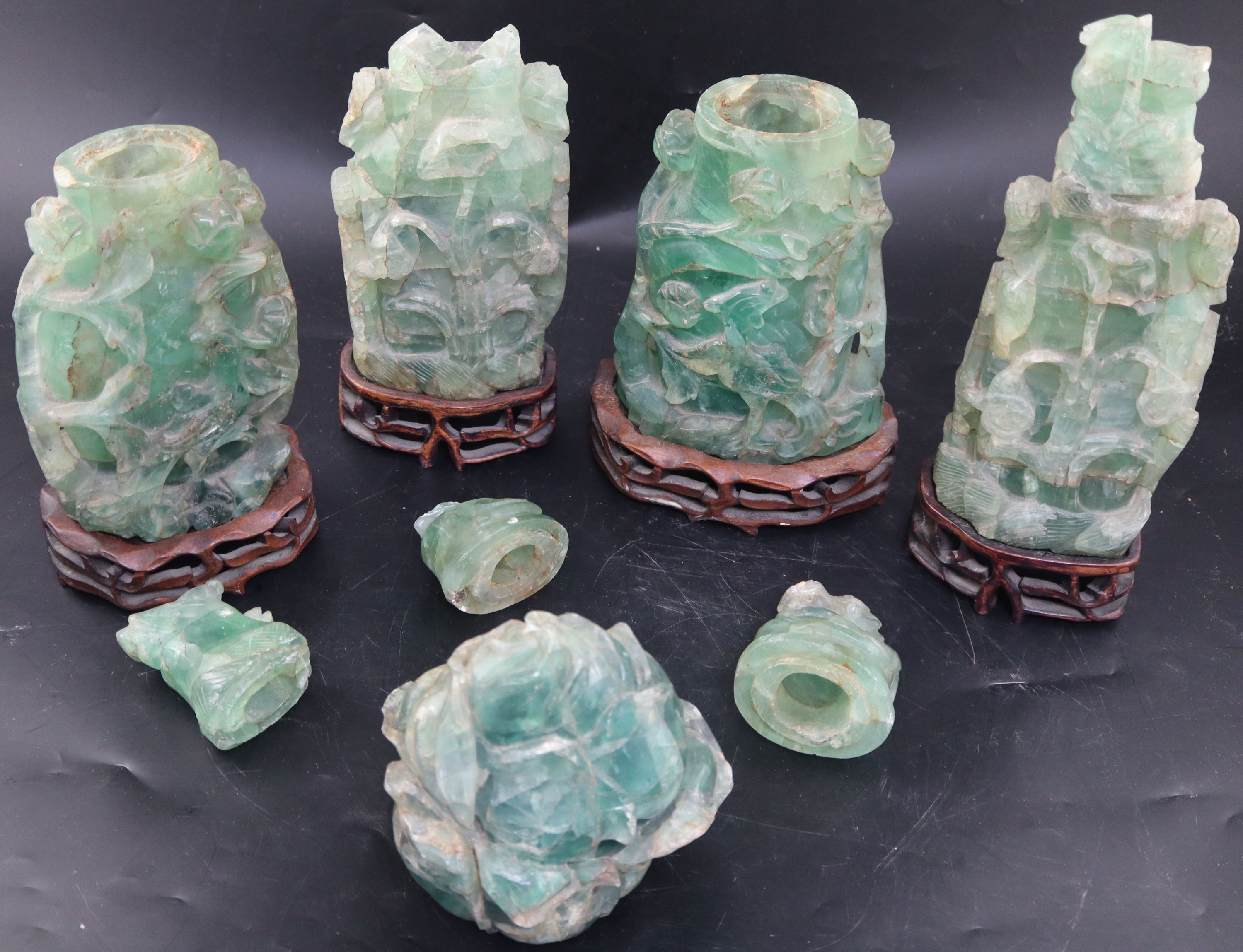 Four late 19th / early 20th century Chinese green quartz vases and covers, largest 27.5cm